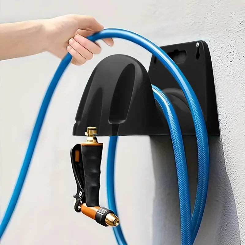 A wall mounted garden hose rack made of heavy-duty plastic for storing outdoor garden watering and irrigation tools